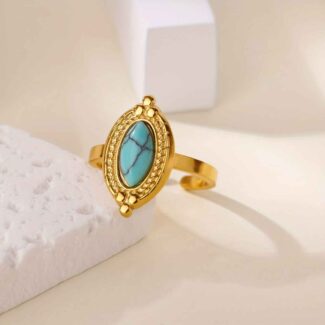 Bague dorée ouverte avec pierre turquoise et détails texturés