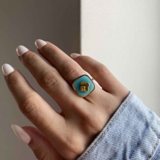 Bague ajustable dorée avec pierre turquoise et motif trèfle doré