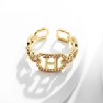 Bague dorée ajustable avec initiale H et pierres scintillantes