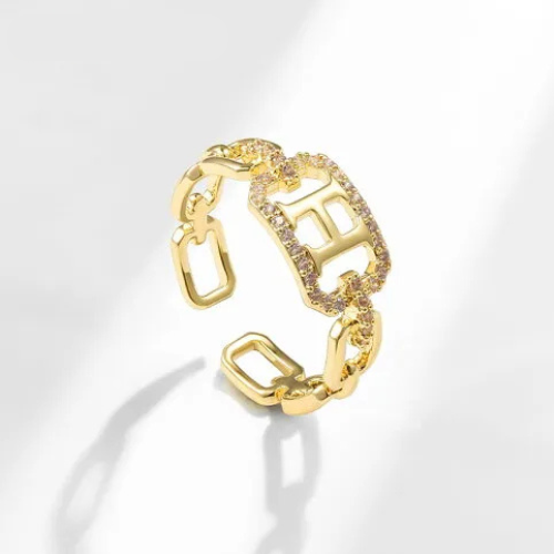 Bague dorée ajustable avec initiale H et pierres scintillantes