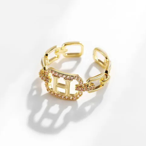 Bague dorée ajustable avec initiale H et pierres scintillantes