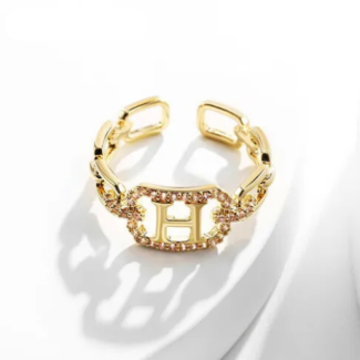 Bague dorée ajustable avec initiale H et pierres scintillantes