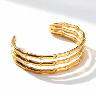 Bracelet manchette doré avec design bambou à trois bandes
